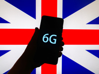 6G sign is seen on the smartphone screen with the national flag of the United Kingdom in the background in this  illustration photo taken in...