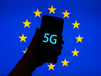 5G sign is seen on the smartphone screen with European Union flag in the background in this  illustration photo taken in Krakow, Poland on S...