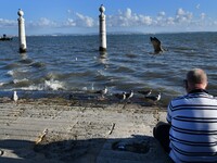 A  man rest near Tejo river banks in Cais das Colunas area, Lisbon, Portugal on September 27, 2021. Portugal is gradually returning to norma...