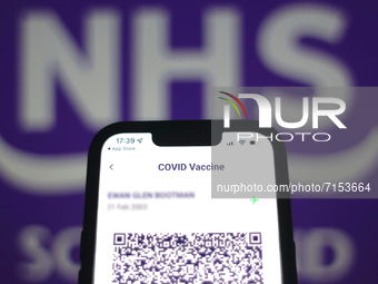 Scotlands Vaccine Passport App is seen on a smartphone screen with the Scottish NHS logo in the background in this illustration photo taken...