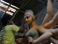 An artisan makes an idol of Hindu Goddess Durga at Kumartuli, the potter's village in Eastern India city Kolkata, India on October 01, 2021...