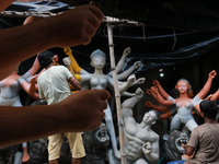 An artisan makes an idol of Hindu Goddess Durga at Kumartuli, the potter's village in Eastern India city Kolkata, India on October 01, 2021...