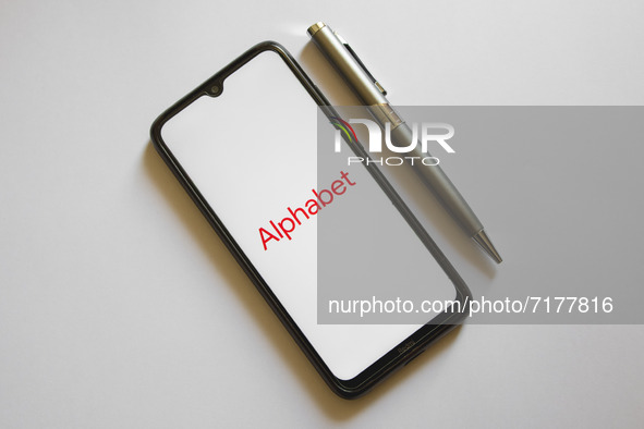 In this photo illustration an Alphabet logo is display on a smartphone screen and a pencil in Athens, Greece on October 4, 2021. 