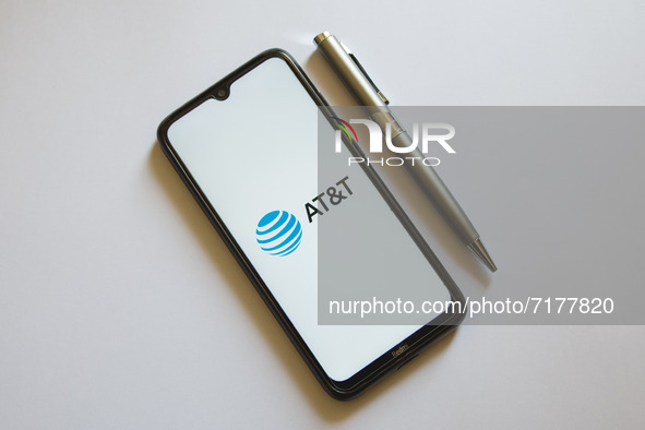 In this photo illustration an AT&T logo is display on a smartphone screen and a pencil in Athens, Greece on October 4, 2021. 