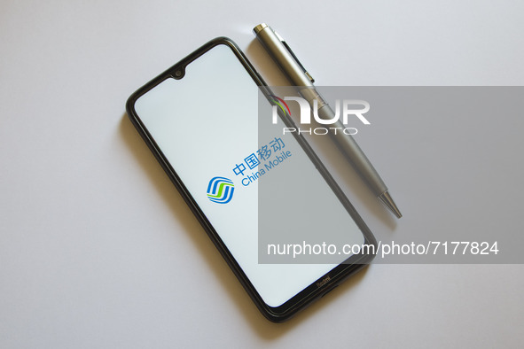 In this photo illustration a China Mobile logo is display on a smartphone screen and a pencil in Athens, Greece on October 4, 2021. 