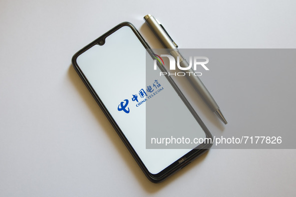 In this photo illustration a China Telecom logo is display on a smartphone screen and a pencil in Athens, Greece on October 4, 2021. 