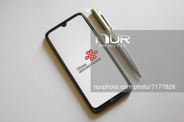 In this photo illustration a China Unicom logo is display on a smartphone screen and a pencil in Athens, Greece on October 4, 2021. 