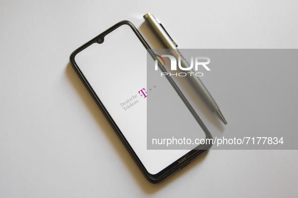In this photo illustration a Deutsche Telekom logo is display on a smartphone screen and a pencil in Athens, Greece on October 4, 2021. 