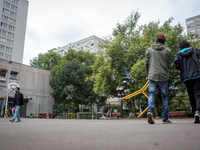migrants moving chairs in the courtyard the Jean Quarré school in Paris on 2015/08/04. Since friday, the migrants occupy the jean quarre sch...
