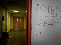 Occupation of the Jean Quarré school by migrants in Paris on 2015/08/04.
In photo: Entrance of the school Tchad graffiti on the wall of the...
