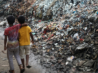 Children walk through the tannery area in Hazaribag, Dhaka, Bangladesh on October 06, 2021. Though many leather factories have already been...