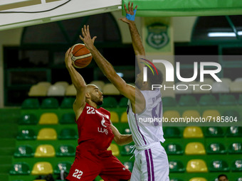 (22) Michael Jovan Thompson from Al-Ahli team trying to pass the ball and (91) Sergio El - Darwich  from Beirut team trying to defeat him du...