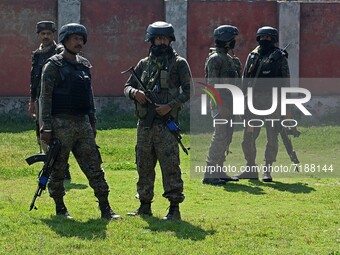 SRINAGAR, KASHMIR, INDIA-OCTOBER 07: Indian soldiers stand in the premises of the school building where two teachers were shot dead by gunme...