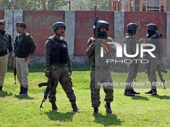 SRINAGAR, KASHMIR, INDIA-OCTOBER 07: Indian soldiers stand outside the school building where two teachers were shot dead by gunmen including...
