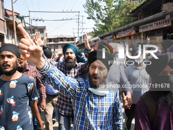 Sikh mourners shout slogans as they carry the dead body of the slain school principal Supinder Kaur in Srinagar, Indian Administered Kashmir...