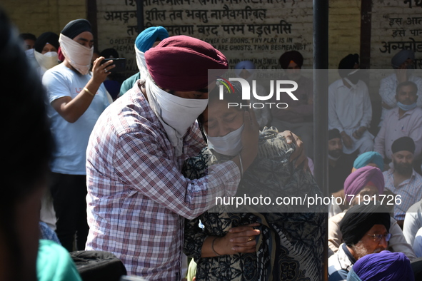 Sikh mourners wail around the dead body of the slain school principal Supinder Kaur in Srinagar, Indian Administered Kashmir on 8 October 20...