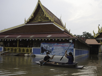 Oct 8, 2021, Villagers who live in the same area as the temple use boats as a means of transportation. (