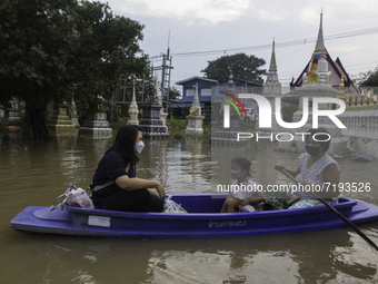 Oct 8, 2021, Villagers used boats to enter their homes when the flood water was high. (