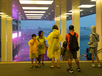 People seek shelter at Harbour City as typhoon Lionrock batters the city, in Hong Kong, China, on October 9, 2021.  (