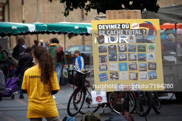 A Greenpeace member waits for passers-by near the play titled 'Guess whre hides Total ?'  Greenpeace Toulouse organized a play in the center...