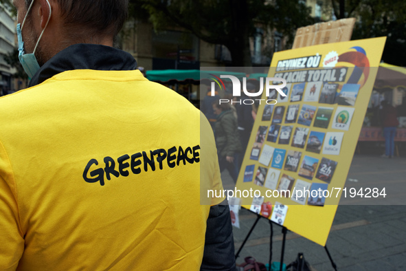 A Greenpeace member waits for passers-by near the play titled 'Guess whre hides Total ?'  Greenpeace Toulouse organized a play in the center...