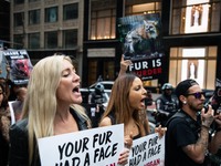 Hundreds of demonstrators gathered at the Pulitzer Fountain in New York and marched to Times Square calling on various clothing companies to...