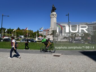 People walk near the Marques de Pombal monument, Lisbon. 07 October 2021. Portugal has about nine million people vaccinated with at least on...