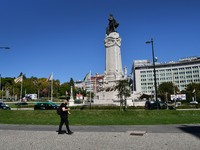 A man walks near the Marques de Pombal monument, Lisbon. 07 October 2021. Portugal has about nine million people vaccinated with at least on...
