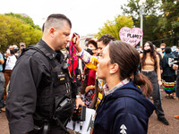 Native American activists are confronted by US Park Police in a civil disobedience action at the White House against the continued use of fo...