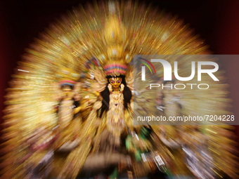 An idol of the Goddess Durga is seen on a makeshift place of worship on the occasion of Durga Puja festival in Kolkata on October 11,2021. (