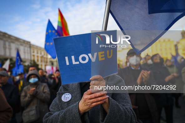 A woman holds 'I Love EU' banner during 'We're staying in EU' demonstration at the Main Square in Krakow, Poland on October 10, 2021. The pr...