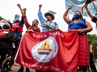 Native American activists lead a march from Freedom Plaza to the White House against continued use of fossil fuels on Indigenous Peoples' Da...