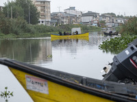 An Iranian man boating along a river next to a local bazaar in the seaport city of Anzali 366 Km (227 miles) north of Tehran amid the new co...