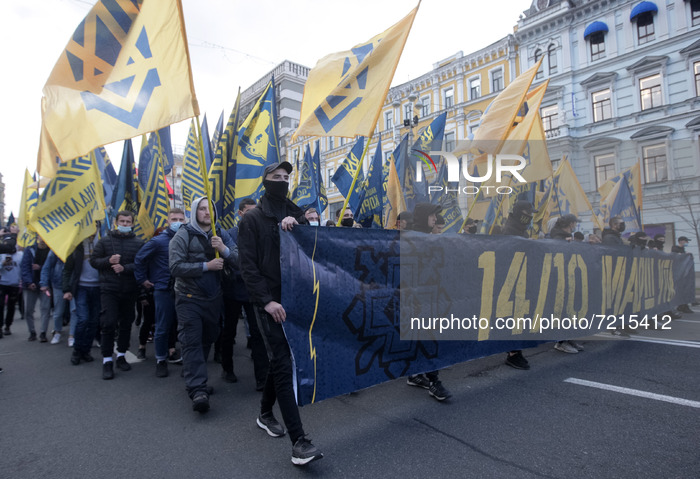 Ukrainians take part at a rally dedicated to the Defender of Ukraine Day and the Day of Ukrainian Insurgent Army creation in central of Kyiv...