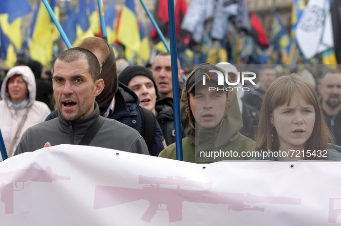 Ukrainians take part at a rally dedicated to the Defender of Ukraine Day and the Day of Ukrainian Insurgent Army creation in central of Kyiv...