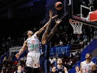 Jordan Mickey (C) of Zenit and Augustine Rubit #21 of Bayern vie for the ball during the EuroLeague Basketball match between Zenit St. Peter...