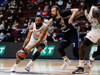 Sergey Karasev (C) of Zenit in action against Darrun Hilliard (L) and Othello Hunter of Bayern during the EuroLeague Basketball match betwee...