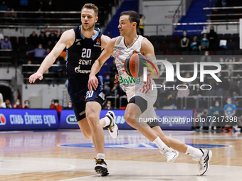 Andrey Zubkov (L) of Zenit and Zan Mark Sisko of Bayern in action during the EuroLeague Basketball match between Zenit St. Petersburg and FC...