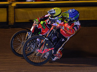 
Chris Harris  (Blue) passes Tom Brennan  (Yellow) during the SGB Premiership Grand Final 2nd leg between Peterborough and Belle Vue Aces at...