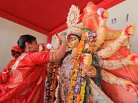 Jaipur: A married woman offer worship during 'Sindoor Khela' before the immersion of Goddess Durga on the last day of Durga Puja festival in...