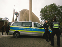 polices are seen during the protest over city decision allowing broadcasting the call for prayer at Cologne central mosque in Cologne, Germa...