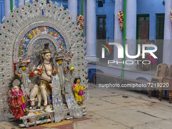 A Durga idol is seen at a house before immersion , on the final day of Durga puja festival in Kolkata , India , on 15 October 2021 . (