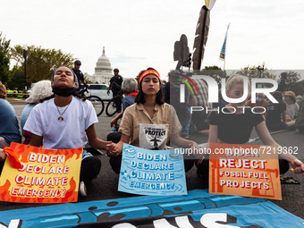 Native American climate activists and allies are arrested at the US Capitol during a youth-led civil disobedience action against the continu...