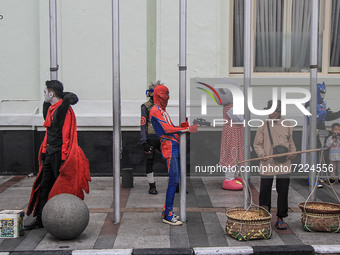Cosplayer is seen entertaining the tourist on October 16, 2021 in Asia Afrika Street, Bandung, West Java, Indonesia. The Bandung City Govern...