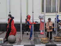 Cosplayer is seen entertaining the tourist on October 16, 2021 in Asia Afrika Street, Bandung, West Java, Indonesia. The Bandung City Govern...