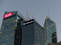  The buildings of AIA (left), China Construction Bank (center) and Bank Of China (right) stand next to each other in Central Hong Kong. (
