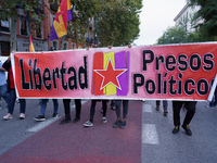 Protestors hold banners as they take part in a demonstration for 