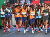 Kenya's Elisha Rotich (4L), winner in the men's race, takes the start of the 42,195 km Paris Marathon, as part of its 45th edition on the Ch...