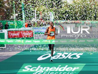 Kenya's Elisha Rotich celebrates on the finish line as he wins the men's race in the 42,195 km Paris Marathon, as part of its 45th edition o...