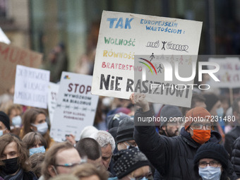 No to racism banner seen during solidarity demonstration with refugees on the Polish Belarusian border in Warsaw on 17 October, 2021. (